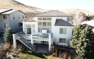 exterior house painted in white with deck terrace